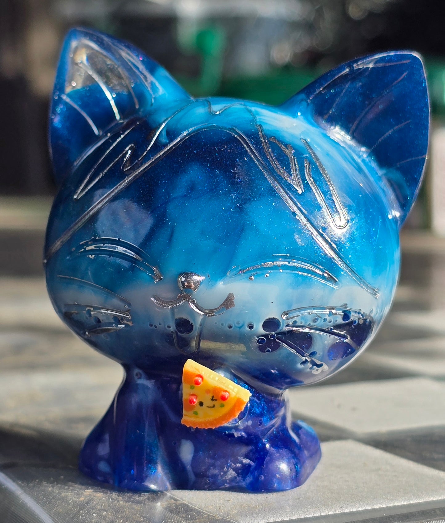 Blue cat eating pizza