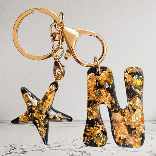 Keycharm alphabet "N" black with golden flakes and starfish